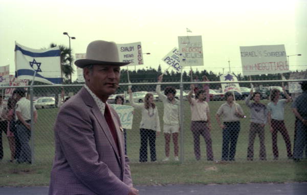 Leon County Sheriff Raymond Hamlin and demonstrators at Tallahassee Airport for the arrival of King Hussein of Jordan.