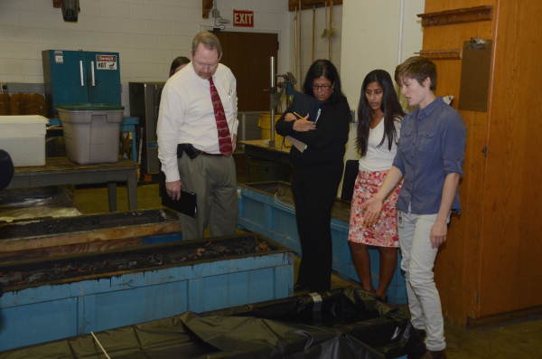 Representatives from the Governor's Office of Policy and Budget (OPB) shown during a visit to the Department of State's Archaeology Conservation lab.