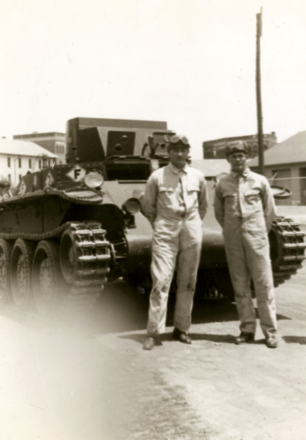 Jay L. Hall and Henry W. McMillan from Company M, 124th Infantry standing in front of a tank at Ft. Benning, Georgia.
