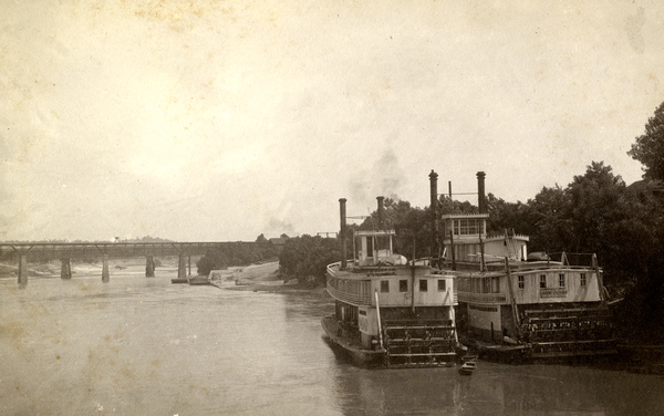 Steamboats Naiad, left, and Fannie Fearn on the Chattahoochee River at the Columbus, Georgia wharf.