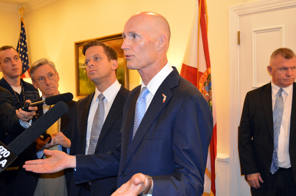 Governor Rick Scott speaking to reporters in Tallahassee about a legislative bill for college students.