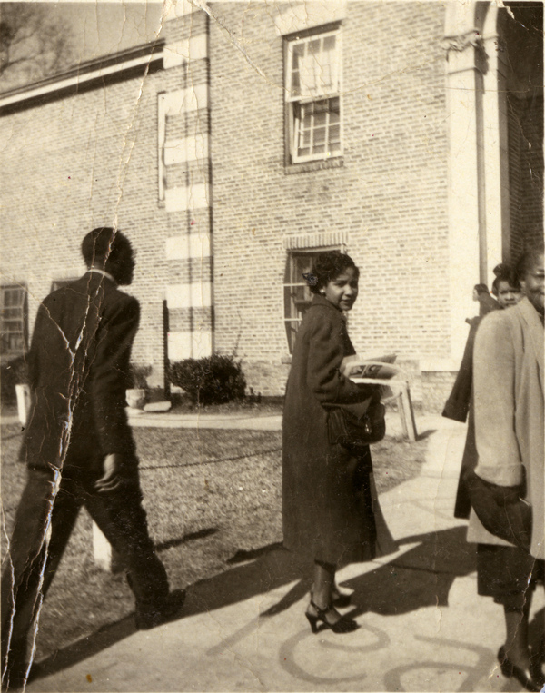 Aquilina Casanas Howell in front of Lincoln High School in Tallahassee.