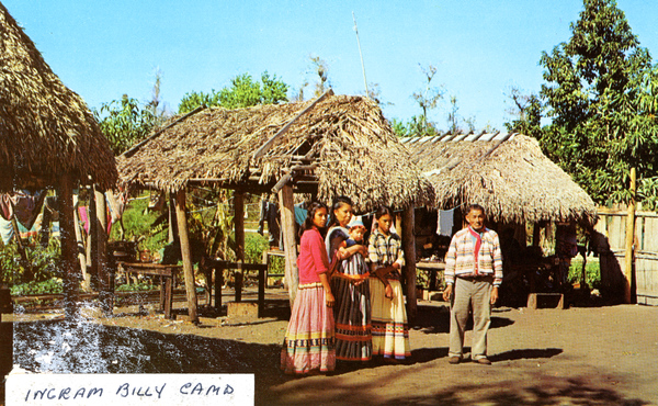 Group portrait of Ingram Billie and family at camp in Ochopee.
