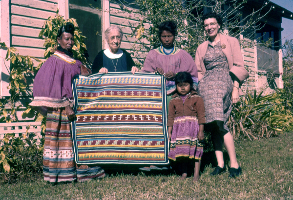 Photographer's wife Gladys posing with Deaconess Bedell and Seminole Indians at Glade Cross Mission in Everglades City.