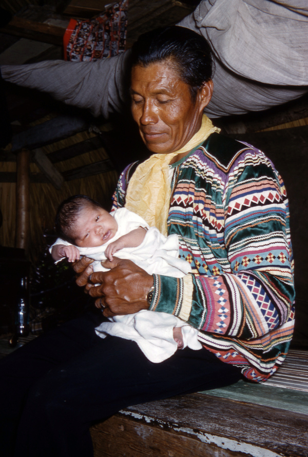 Jimmie Billie with new daughter Marie in the Everglades.