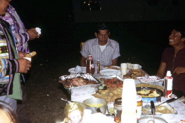 Bobby Clay Billie villagers sharing Christmas feast at Susie Billie's village in Ft. Myers.