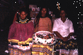 Seminole women with cake during the Christmas feast at Susie Billie's village in Ft. Myers.