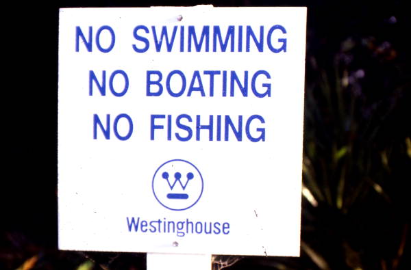 Westinghouse sign prohibiting activities in polluted waters.