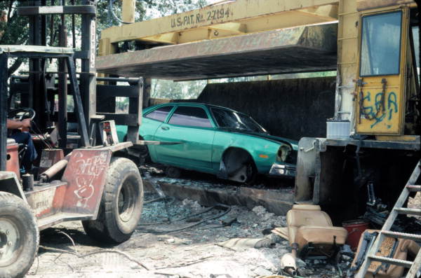 Remains of car being placed in a crusher - Mims, Florida