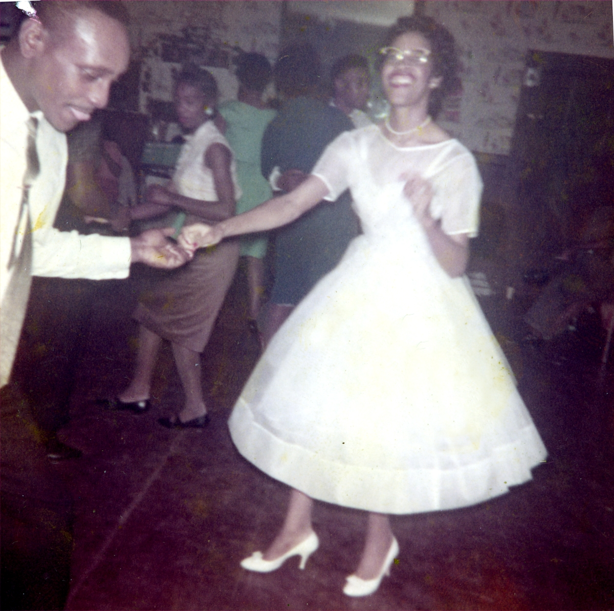 Newlyweds dancing at their wedding celebration in Tallahassee.