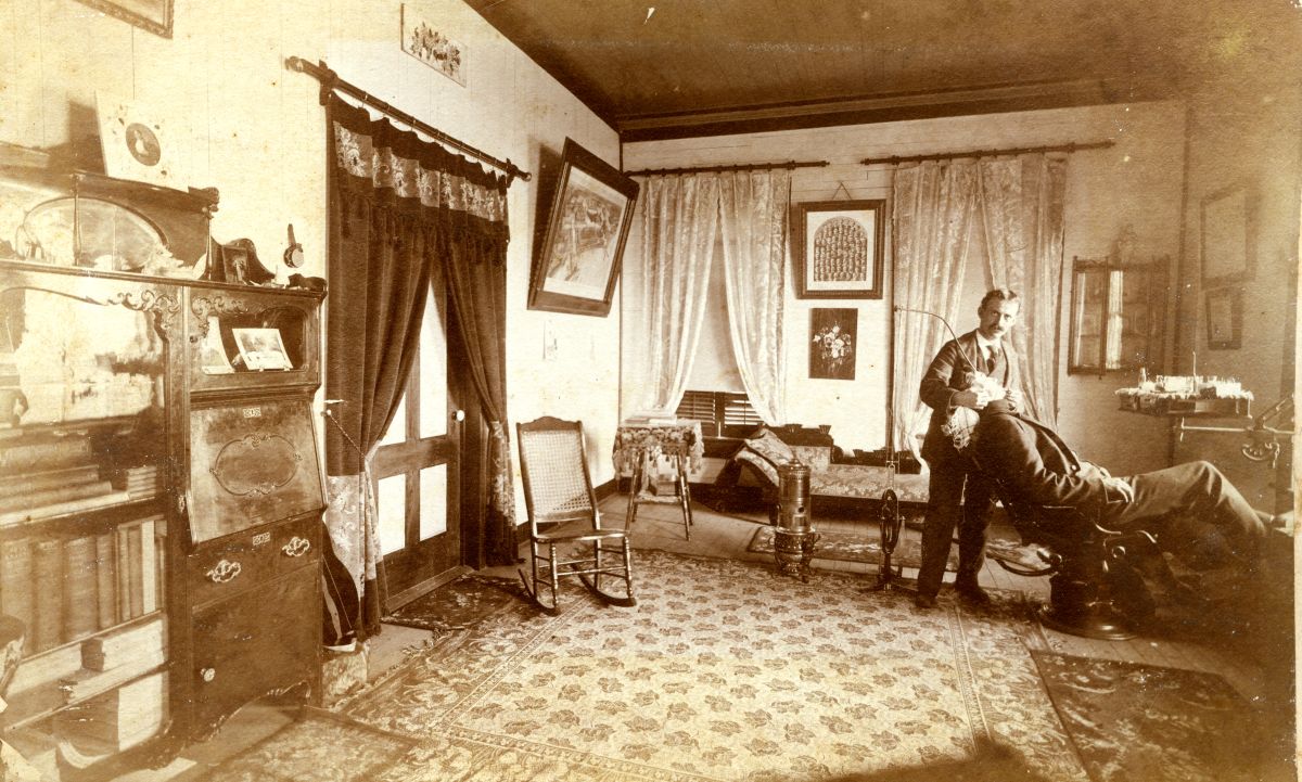 Dentist Charles N. Clark with a patient in his office at 93 Market St. in Apalachicola, Florida.