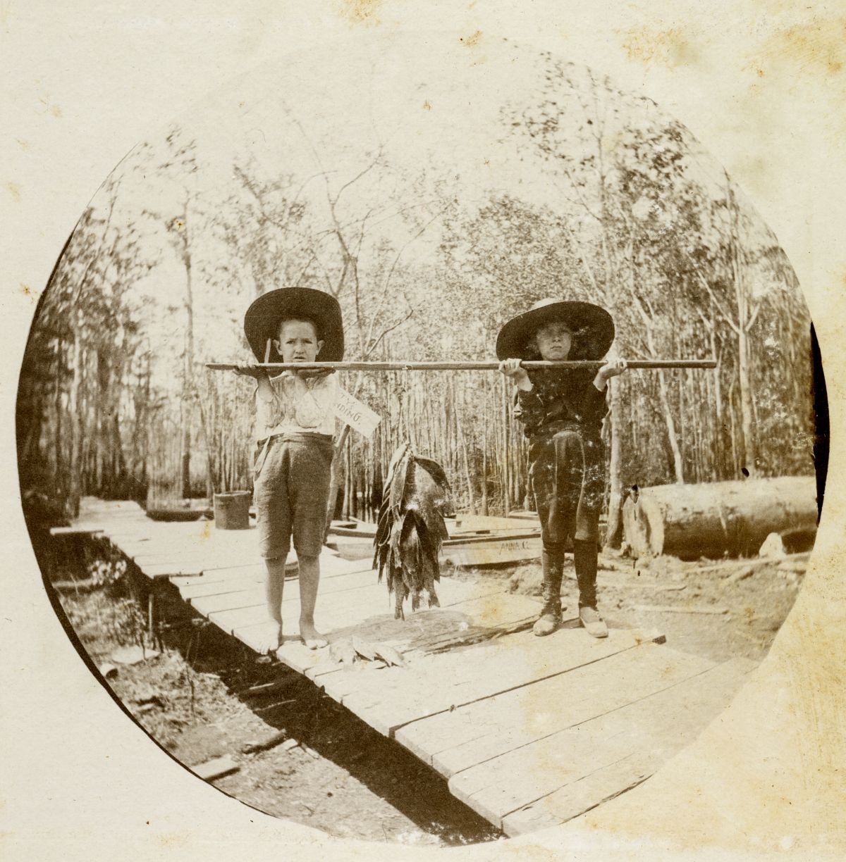 Two children with their catch of fish in Apalachicola, Florida.