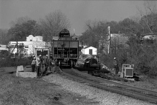 Men work on the railroad tracks - Tallahassee, Florida.