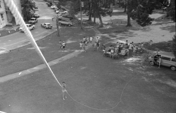 Unidentified person holds on to the rope of a hot air balloon - Tallahassee, Florida.