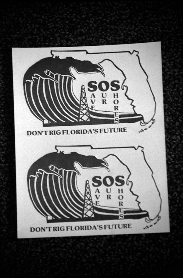 Signs regarding coastal waters and offshore oil drilling - Tallahassee, Florida.