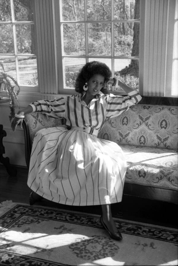 Model sits on a sofa - Tallahassee, Florida.
