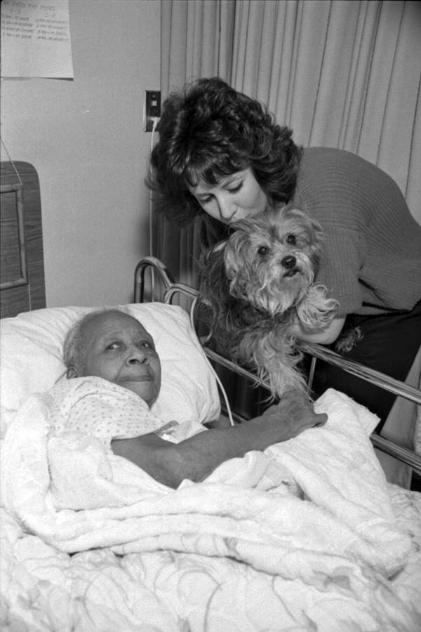 Lisa D'Assaro and Muffin carry out dog therapy with Willa Lampkins - Tallahassee, Florida.