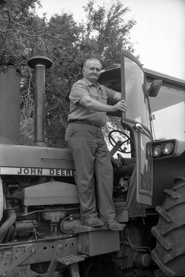 Farmer and his John Deere tractor - Tallahassee, Florida.