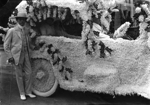 Mayor Everest Green Sewell standing next to a parade float - Miami, Florida.
