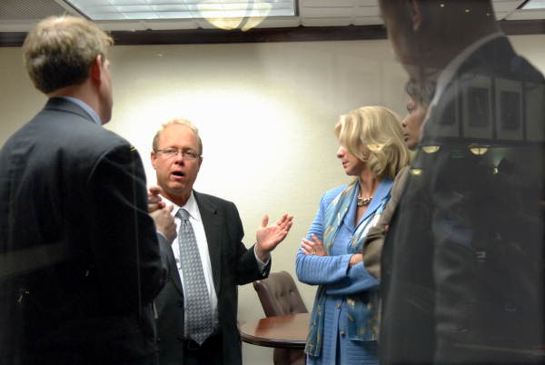 Democratic Caucus Policy Chairman Representative Keith Fitzgerald, D-Sarasota, conferring with Democrats in the "House bubble" just off the House floor in Tallahassee, Florida.
