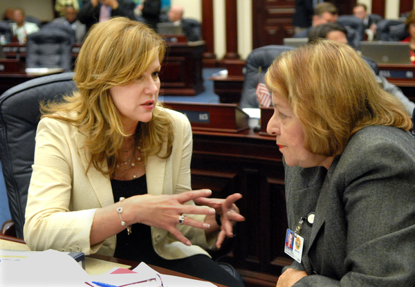 Representatives Ana Logan, R-Miami, left, and Dorothy Hukill, R-Port Orange, conferring on the House floor.