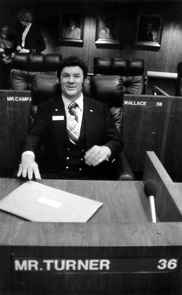 Glenn Turner tries out the House chairs - Tallahassee, Florida
