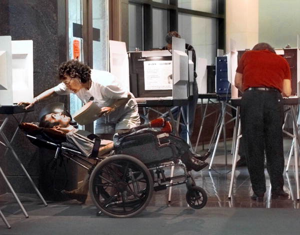 Unidentified woman assisting voter - Tallahassee, Florida