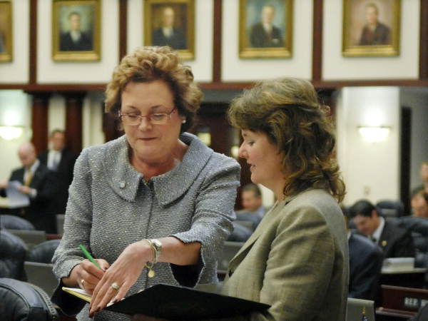 Florida State Representative Trudi Williams, R-Fort Myers, left, conferring with staff member Janice Gilley on the House floor in Tallahassee, Florida.
