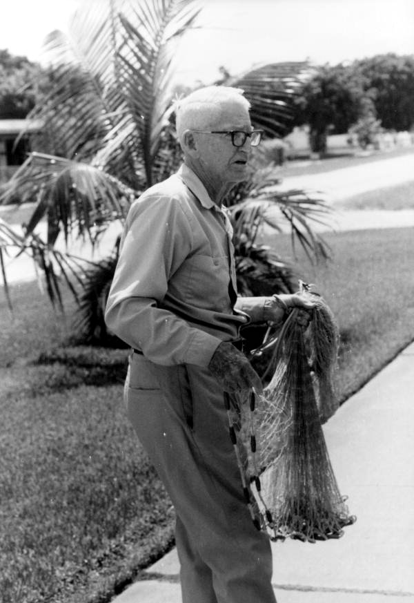Valley Hill preparing to demonstrate the use of his fish cast net.