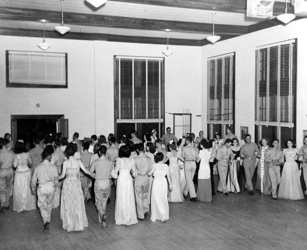 View showing servicemen in the "Grand march" with women at the Gainesville Recreation Department's Service Center.