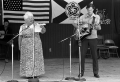 Storyteller Thelma Boltin and folk musician Gamble Rogers on stage at the 1982 Florida Folk Festival.