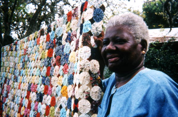 Mrs. Josephine Burns with her yoyo quilt in Eatonville, Florida.