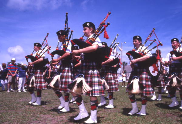 View showing a Scottish pipe band during their performance at the Highland Games in Dunedin, Florida.