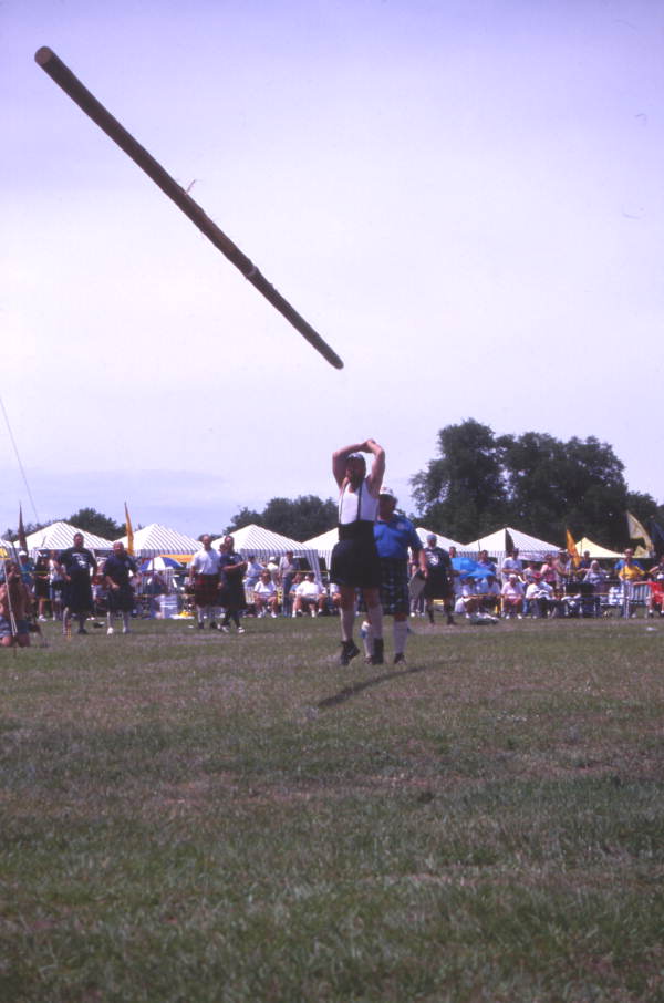 Contestant "turning the caber" during the Highland Games in Dunedin, Florida.