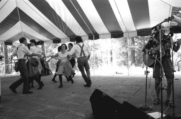 Cloggers perform to an accompanying guitarist at the 1995 Florida Folk Festival- White Springs, Florida