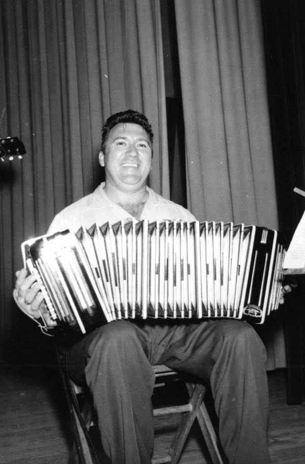 Joe Tomazin from Samsula playing an accordion at the 1956 Florida Folk Festival - White Springs, Florida