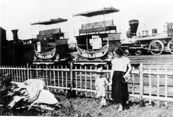 Mother and child by the B. and O. Railroad's first passenger train