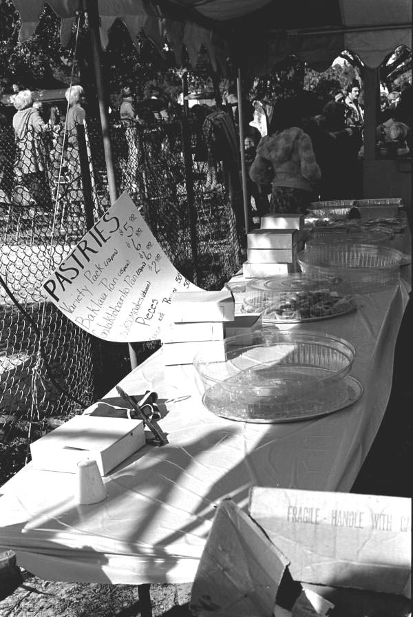 Table with Greek pastries for sale at Epiphany Day - Tarpon Springs, Florida