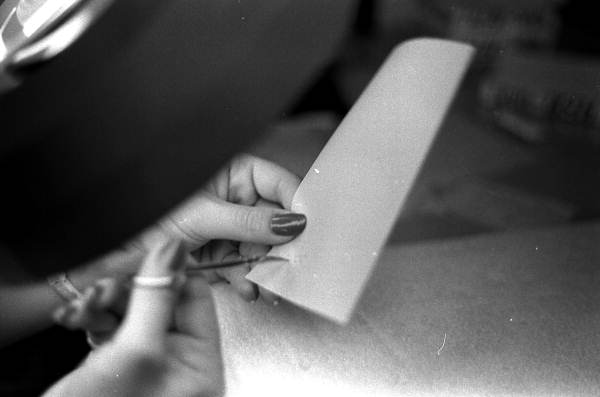 Close-up of Maria Marulanda making decorative cuts in parchment during cardmaking - Miami, Florida.