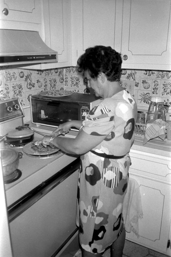 Salma Sinclair cooking Jamaican peas and rice - West Palm Beach, Florida.
