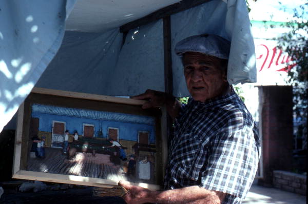 Folk Heritage Award winner Mario Sanchez with one of his paintings- Key West, Florida.