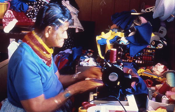 Lottie Shore using a sewing machine.