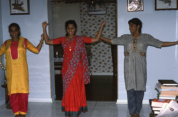 Nila Radhakrishnan (in red) teaching apprentices Prema Menon (L) and Priya Menon East Indian dance- Dade City, Florida