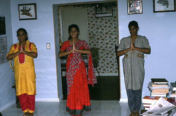 Nila Radhakrishnan (in red) teaching apprentices Prema Menon (L) and Priya Menon East Indian dance- Dade City, Florida