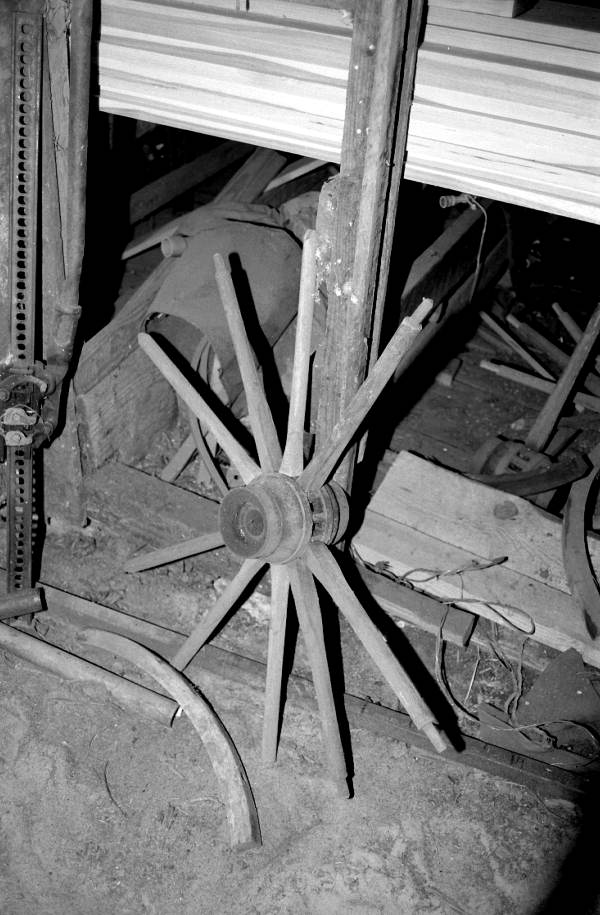 Wagon wheel being worked on by wheelwright John Luther- McAlpin, Florida