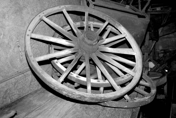 Wagon wheel being worked on by wheelwright John Luther