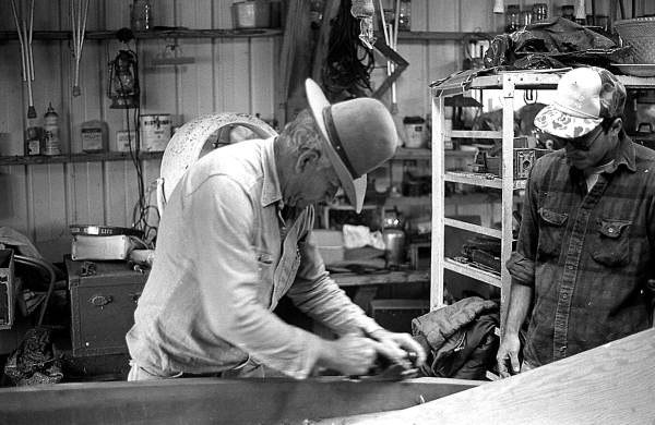 Glen Simmons and apprentice Donald Edwards building an Everglades skiff- Florida City, Florida.