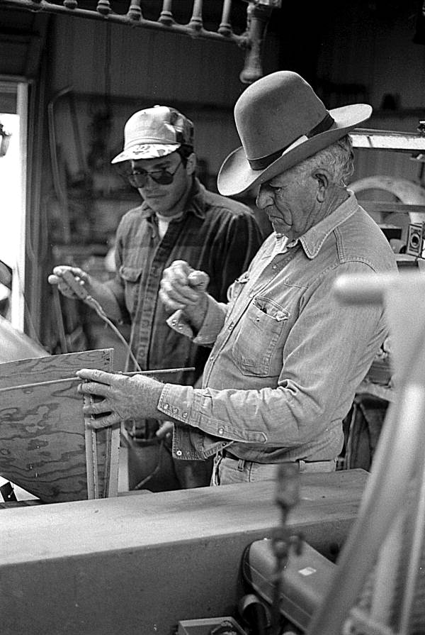 Glen Simmons and apprentice Donald Edwards building an Everglades skiff- Florida City, Florida.