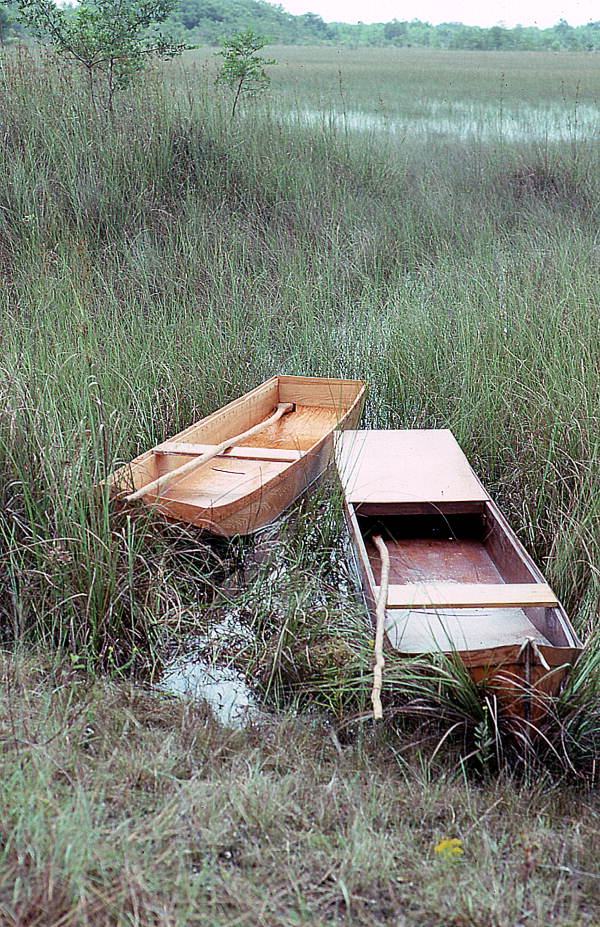 Glades skiffs made by Glen Simmons sitting in the water- Florida City, Florida