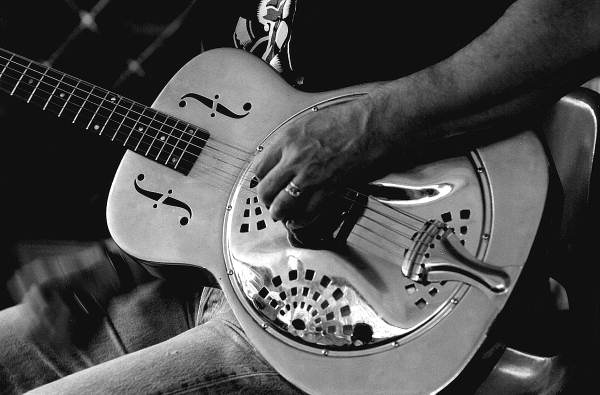 Detailed view of Tampa Blue playing six string slide blues guitar - Tampa, Florida.